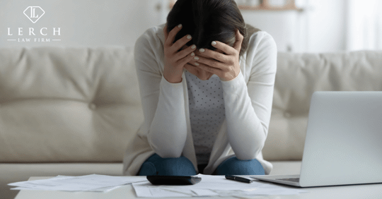 woman looking at bills stressed out